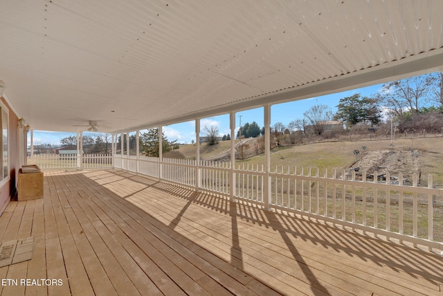 wooden deck with a rural view