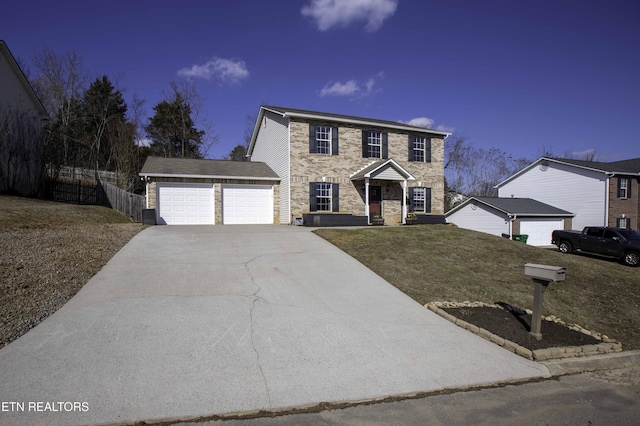 view of front of house featuring a garage and a front lawn