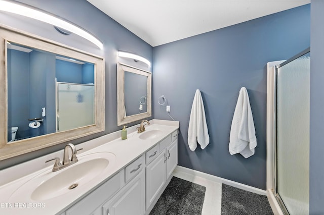 bathroom with vanity and an enclosed shower