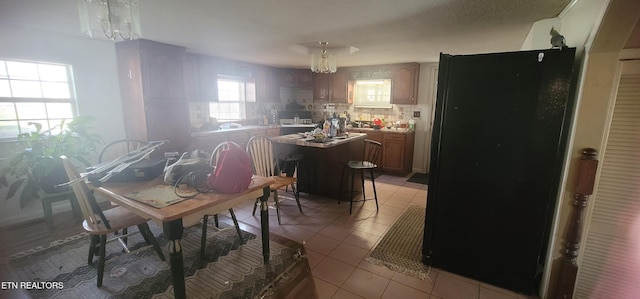 dining room featuring light tile patterned flooring