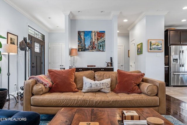 living room with hardwood / wood-style flooring and ornamental molding