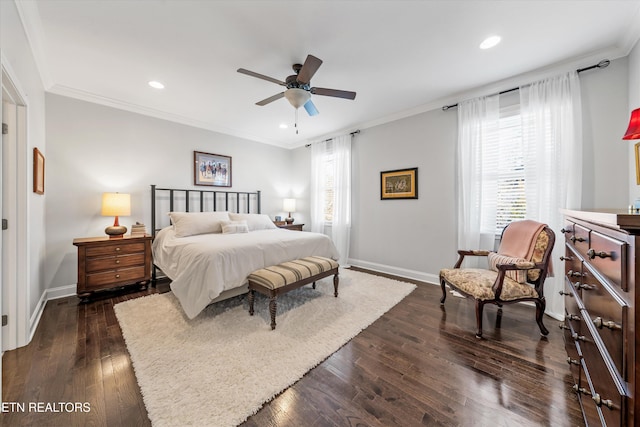 bedroom with dark wood-type flooring, ceiling fan, crown molding, and multiple windows