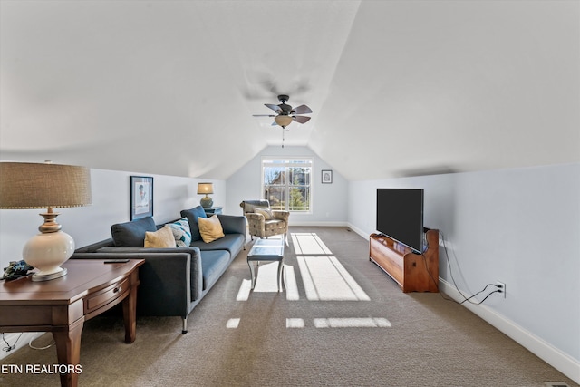 living room with carpet floors, vaulted ceiling, and ceiling fan