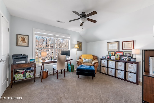 office space featuring lofted ceiling, light colored carpet, and ceiling fan