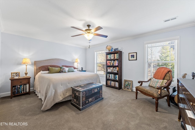 carpeted bedroom with ceiling fan and ornamental molding