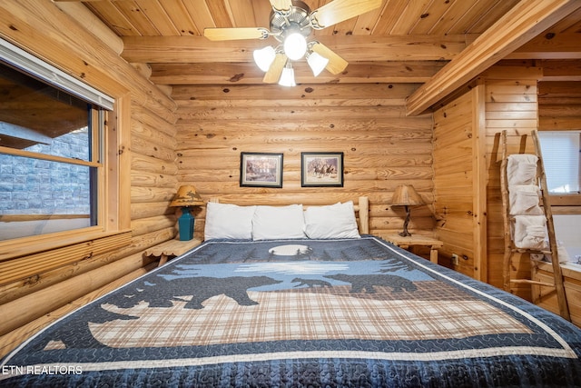 unfurnished bedroom with beam ceiling and wood ceiling