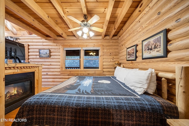 bedroom featuring rustic walls, wooden ceiling, and beam ceiling