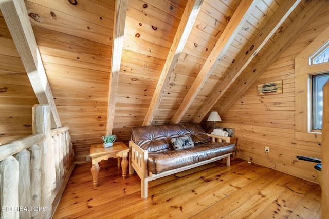 living area with wooden walls, wooden ceiling, lofted ceiling with beams, and hardwood / wood-style floors