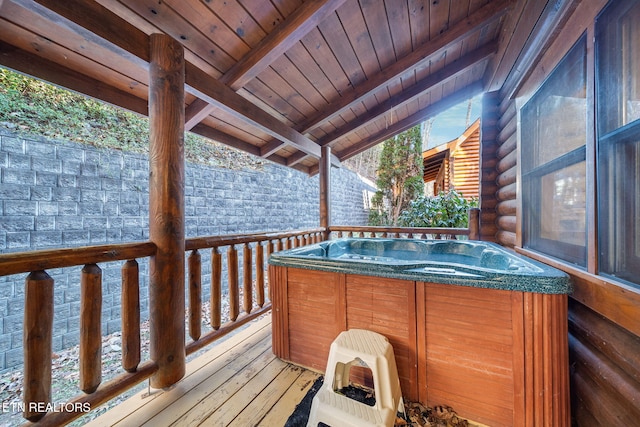 wooden terrace featuring a hot tub