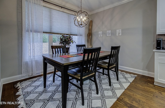 dining room featuring a notable chandelier, dark wood-type flooring, and ornamental molding