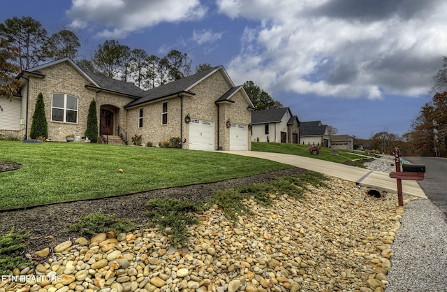 view of front facade with a garage and a front lawn