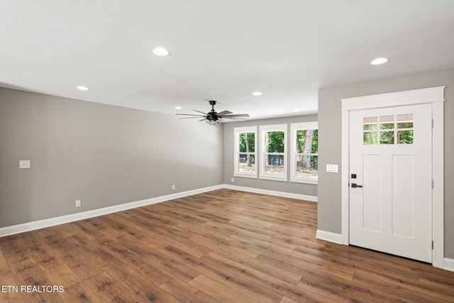 foyer entrance with ceiling fan and hardwood / wood-style floors