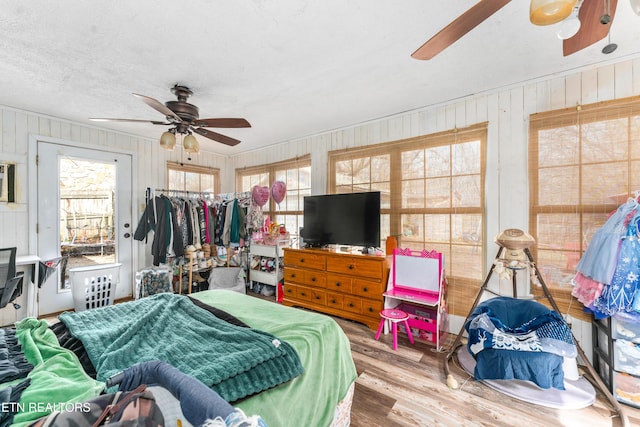 bedroom featuring wood finished floors and a ceiling fan