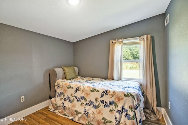 bedroom featuring hardwood / wood-style flooring