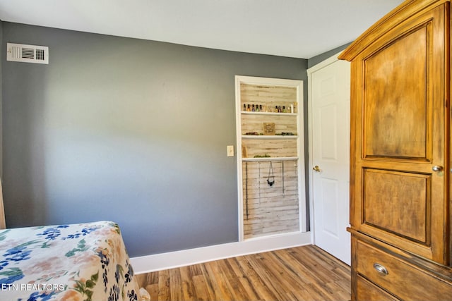 bedroom featuring hardwood / wood-style flooring