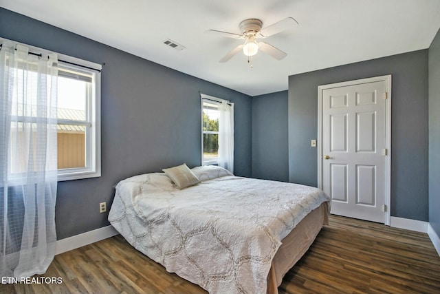 bedroom featuring dark wood-type flooring and ceiling fan