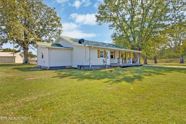 view of front of home with a porch and a front yard