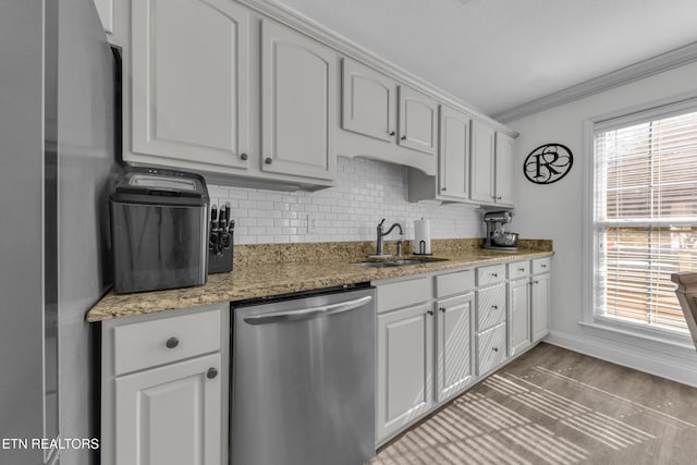 kitchen featuring white cabinetry, light stone counters, crown molding, and dishwasher