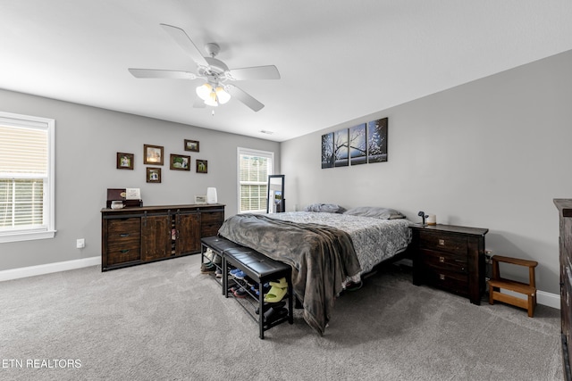 bedroom with ceiling fan and light colored carpet