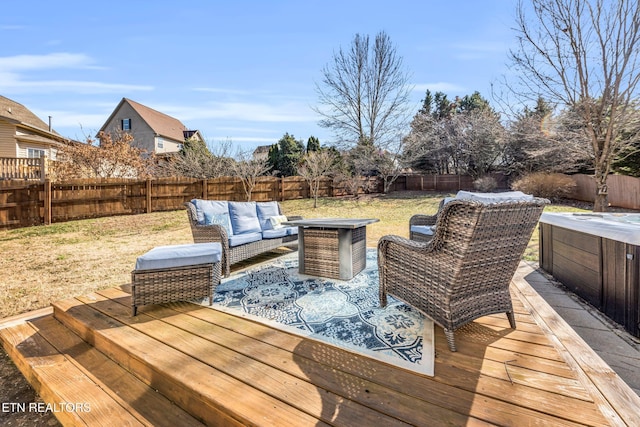 wooden deck featuring an outdoor living space and a yard