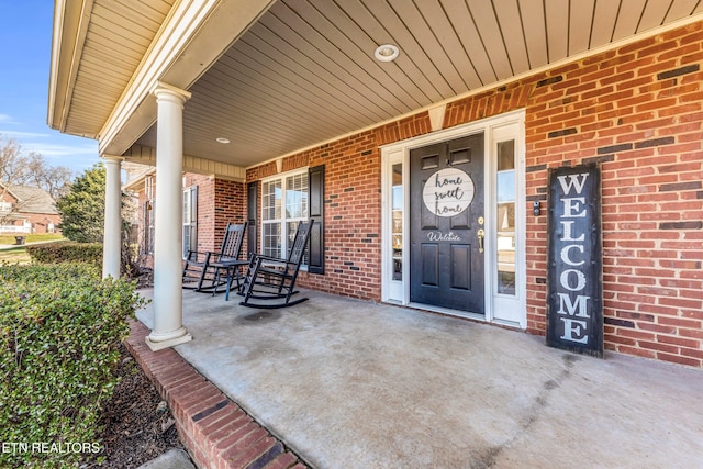 doorway to property featuring covered porch