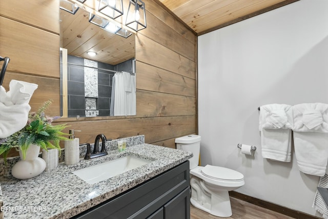 bathroom with wooden walls, a shower with shower curtain, vanity, wooden ceiling, and toilet