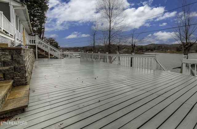 wooden deck featuring a water view