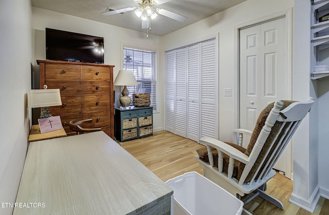 interior space with light hardwood / wood-style floors and ceiling fan