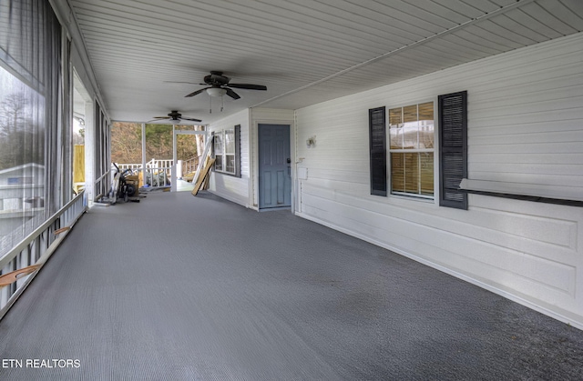 view of patio featuring ceiling fan and a porch