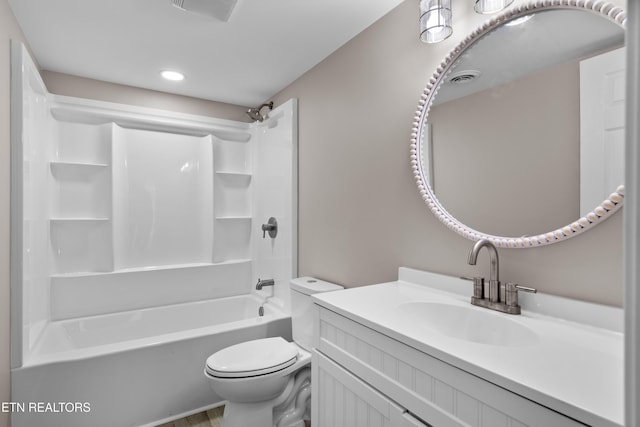 full bathroom with vanity, toilet, and washtub / shower combination