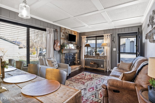 living room featuring coffered ceiling and hardwood / wood-style floors