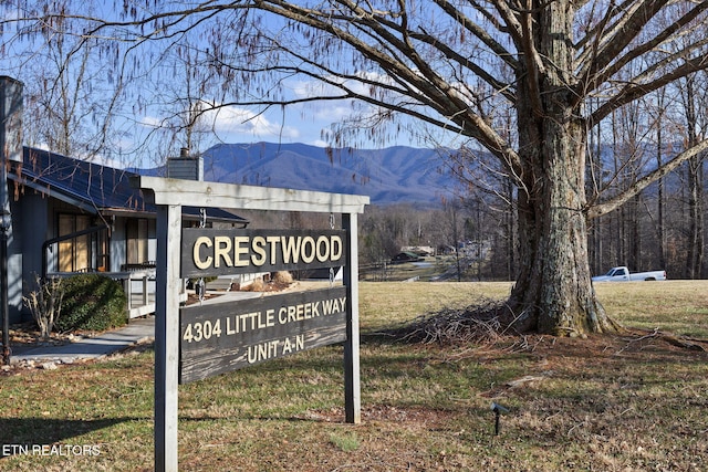 community sign featuring a mountain view