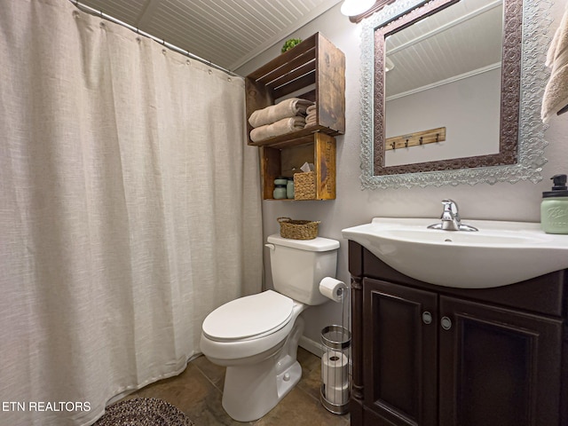 bathroom with vanity, tile patterned floors, and toilet