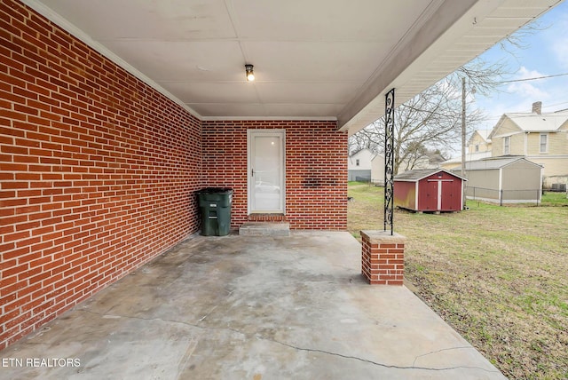 view of patio featuring a storage shed