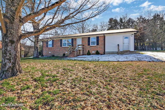 ranch-style home with a front lawn