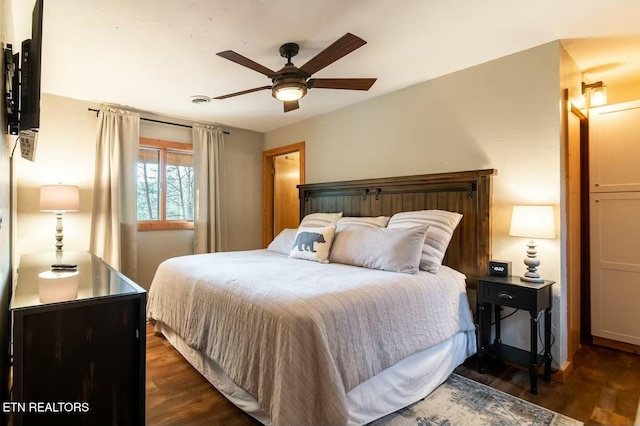 bedroom featuring dark hardwood / wood-style flooring and ceiling fan