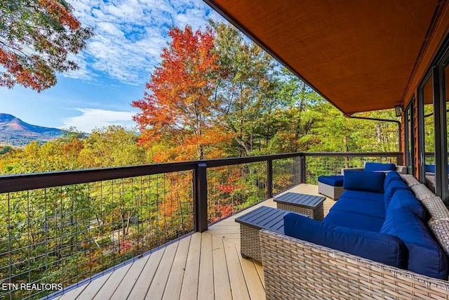 deck featuring outdoor lounge area