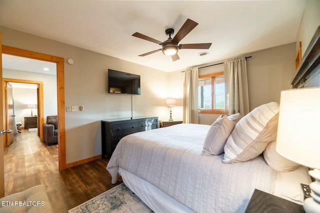 bedroom with wood-type flooring and ceiling fan