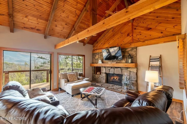 living room featuring high vaulted ceiling, a fireplace, beamed ceiling, hardwood / wood-style flooring, and wooden ceiling