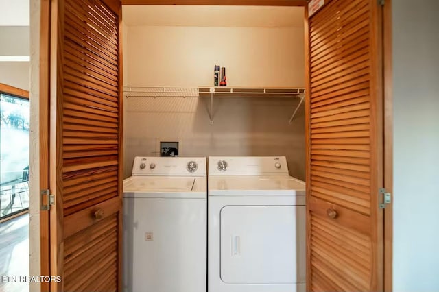 laundry area with washing machine and clothes dryer