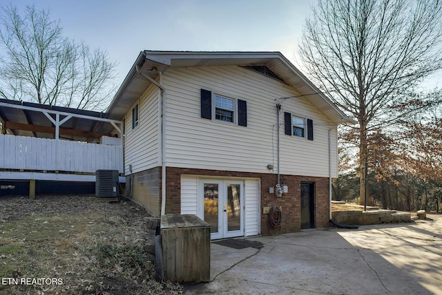 back of house featuring french doors, a patio, and central air condition unit