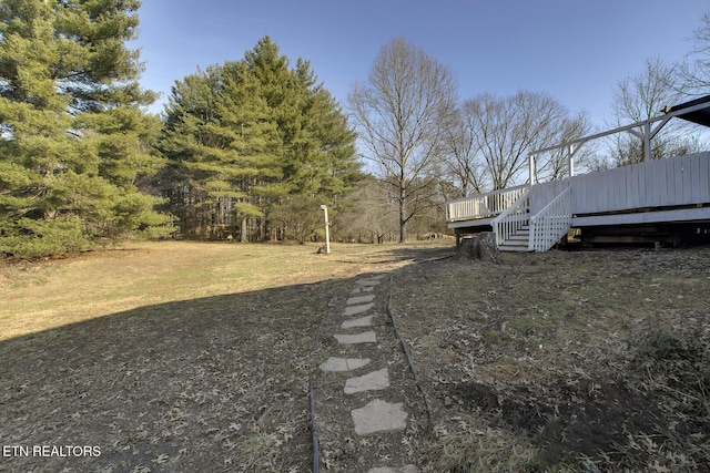 view of yard with a wooden deck