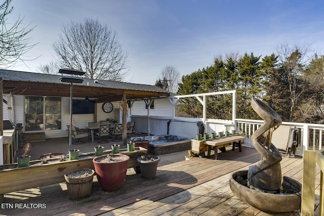 deck featuring an outdoor fire pit