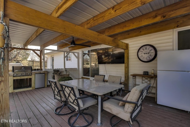 wooden deck featuring an outdoor kitchen and grilling area