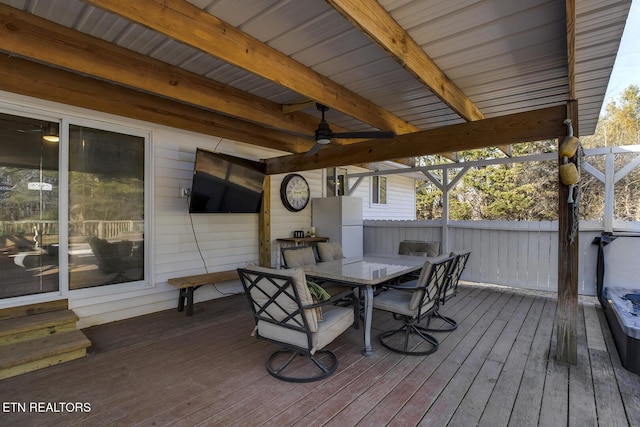 wooden deck featuring ceiling fan