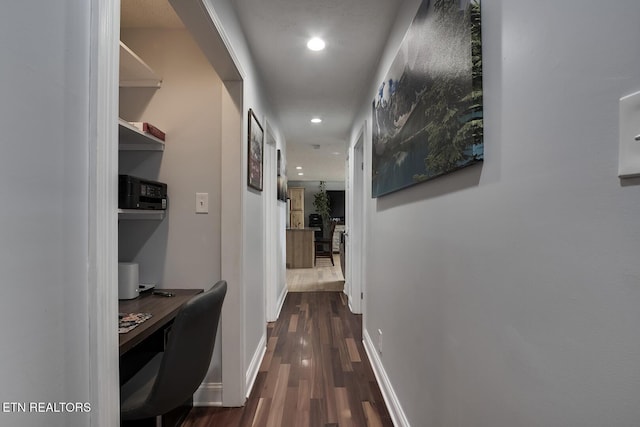 hall featuring dark wood-type flooring