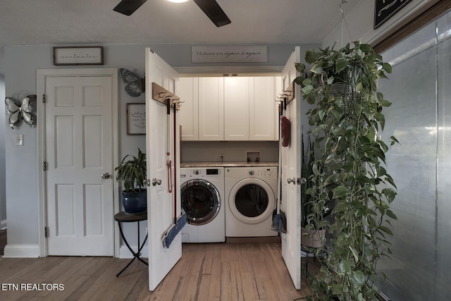 laundry room with ceiling fan, cabinets, separate washer and dryer, and light hardwood / wood-style floors