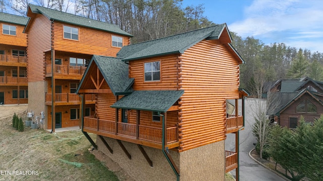 back of property featuring a balcony