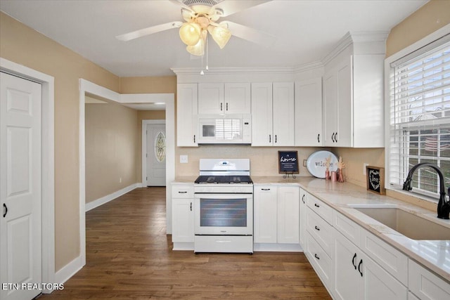 1231 Jefferson Ave, Maryville, TN 37804 - kitchen with white appliances, dark wood-style floors, white cabinetry, and a sink