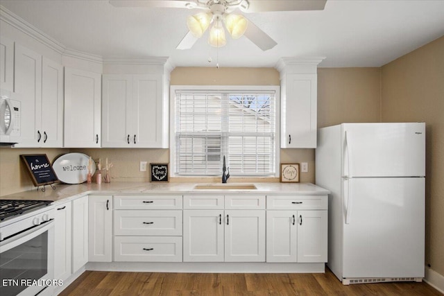 1231 Jefferson Ave, Maryville, TN 37804 - kitchen with ceiling fan, white appliances, wood finished floors, a sink, and white cabinets